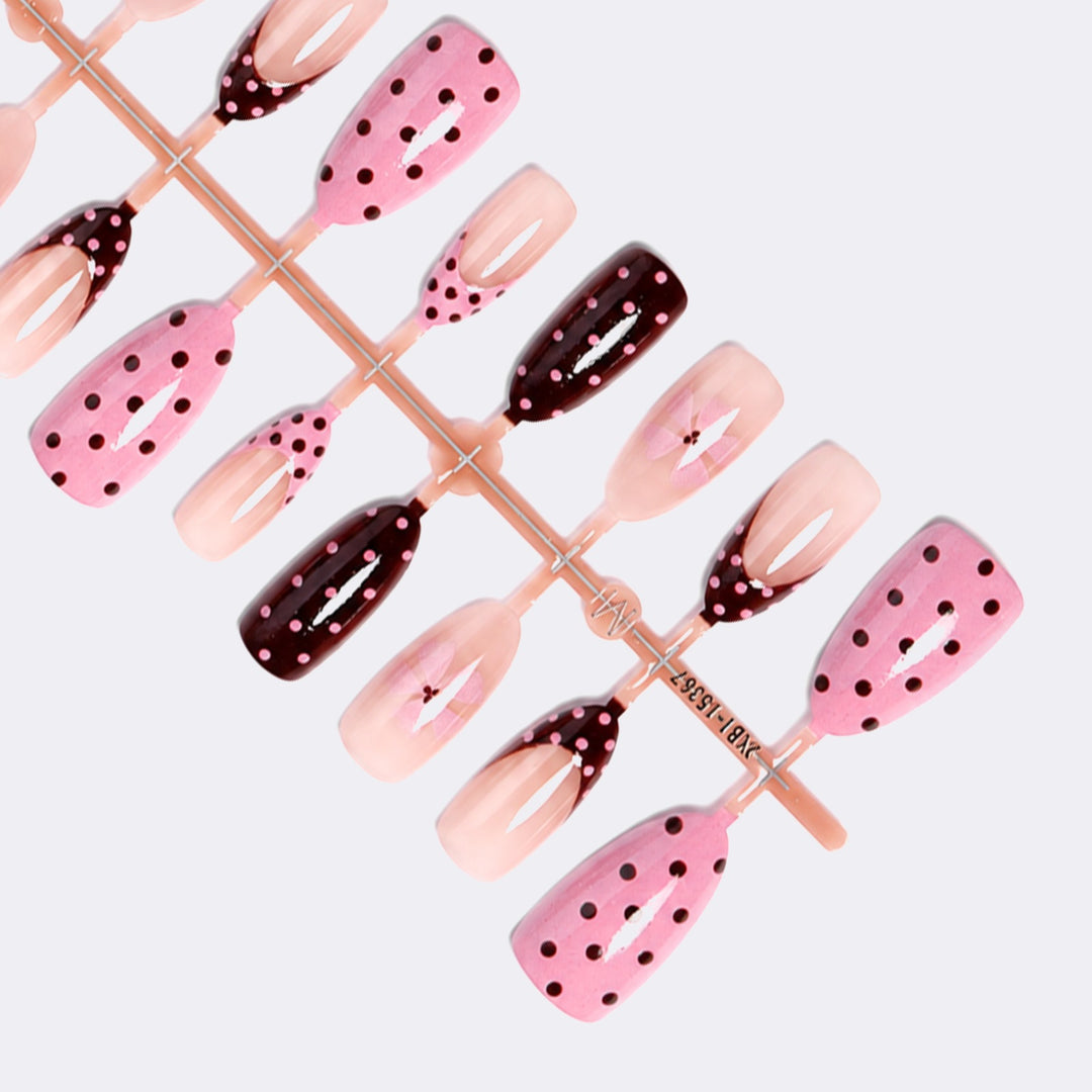 Artificial nail set with playful dots and floral accents Stornfield