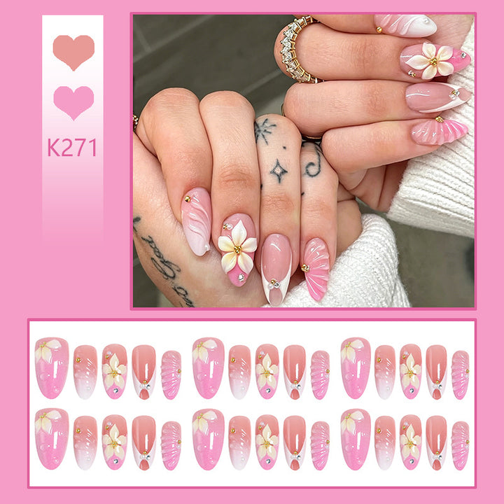 Nail art set with filigree flower patterns and sparkling accents Stornfield