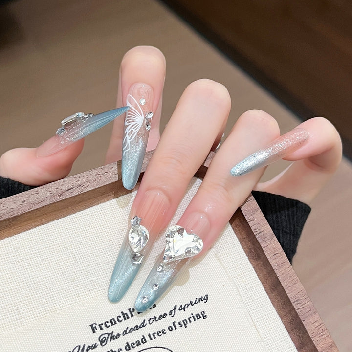 Artistic Stiletto Press-On Nail Art with Glimmering Accents Stornfield
