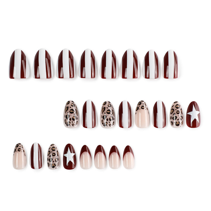 Artful stiletto nails with leopard pattern and elegant glitter decoration Stornfield