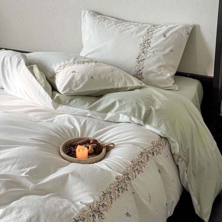 Embroidered cotton percale duvet cover set with fine floral border