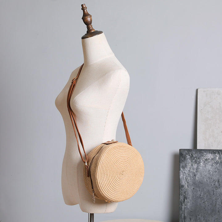 Round shoulder bag made of natural material with stylish accents Stornfield
