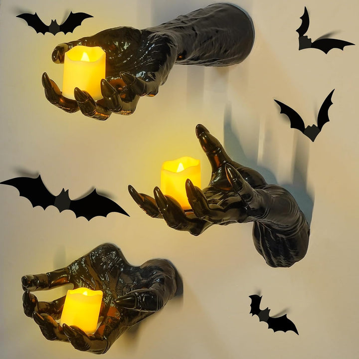 Wall candle holder in realistically shaped hand made of resin