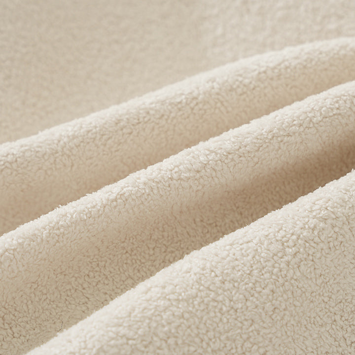 Round floor seat pouf made of teddy plush with a shape-retaining padded core Stornfield