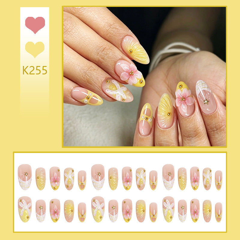 Artificial nails with floral glitter pattern Stornfield