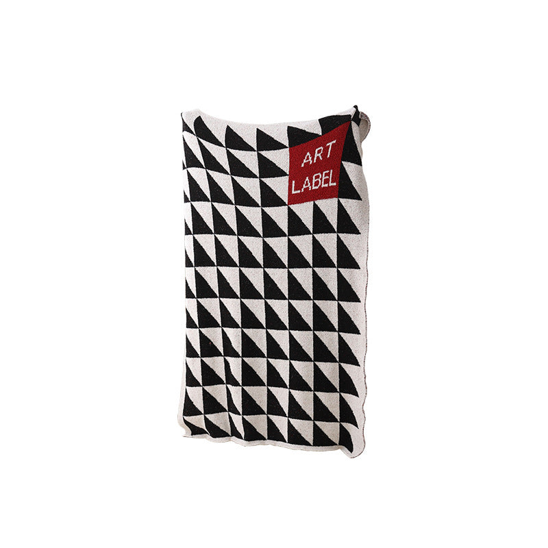 Coarsely woven decorative blanket with geometric jacquard pattern and soft bouclé Stornfield