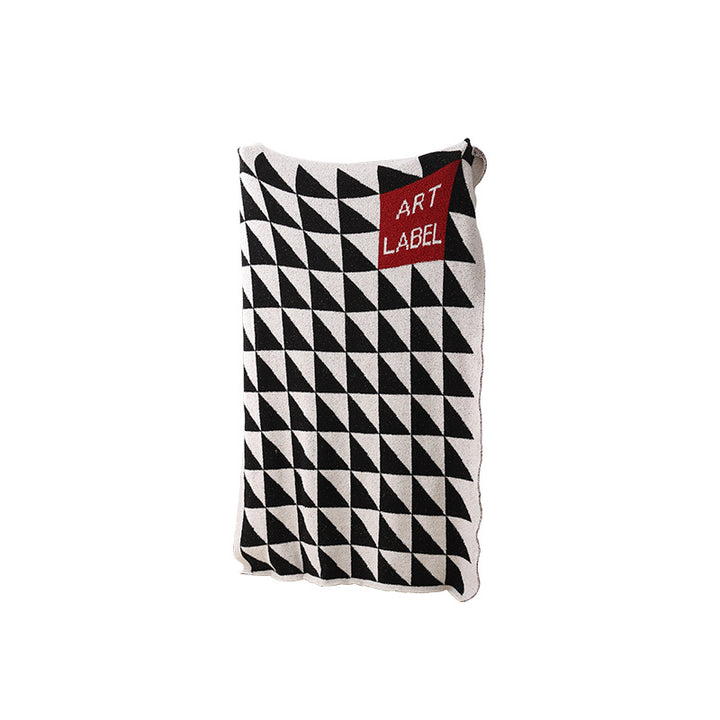 Coarsely woven decorative blanket with geometric jacquard pattern and soft bouclé Stornfield