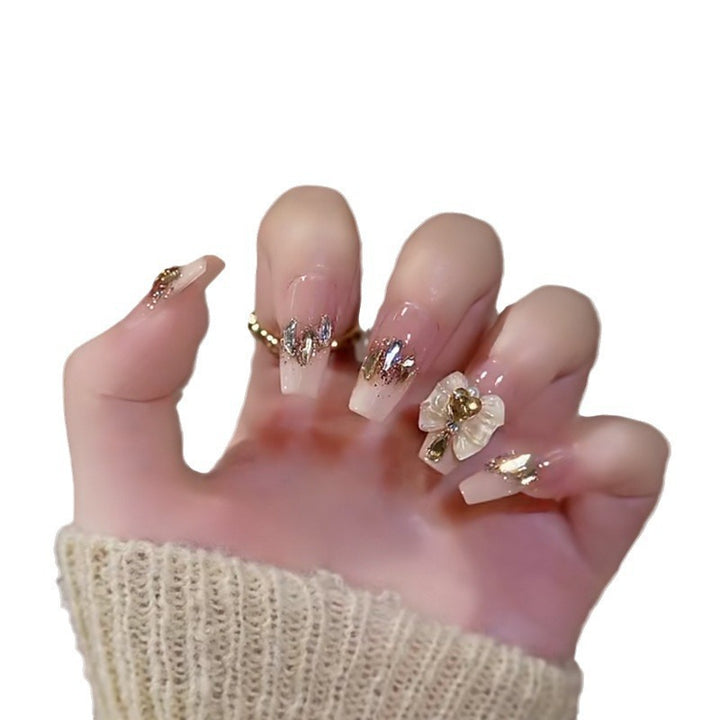 Artificial nails with romantic heart design and glitter coating Stornfield