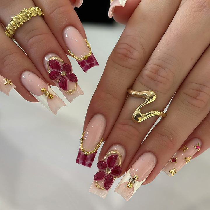 Artificial nail set with floral decorations and elegant accents Stornfield