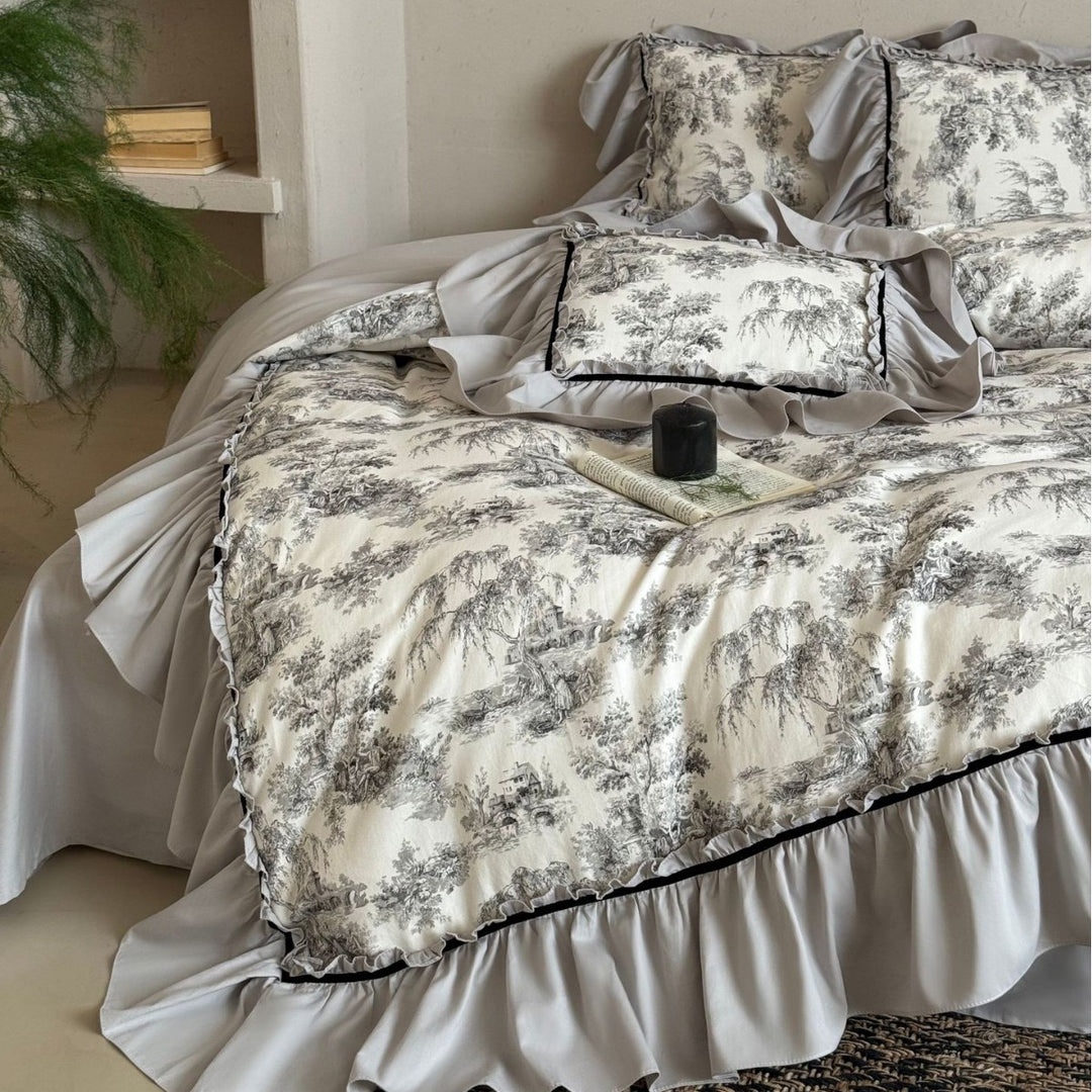 Bedding set with ruffles and toile pattern