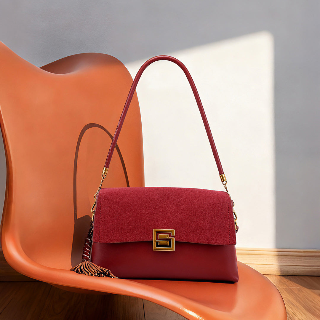 Elegant Suede Handbag with Gold Accents