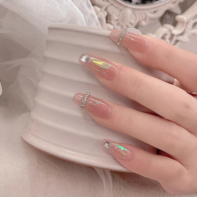 Acrylic nail set with glamorous rhinestone and glitter elements Stornfield