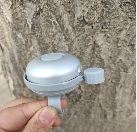 compact bicycle bell with quick-release handlebar mount Stornfield