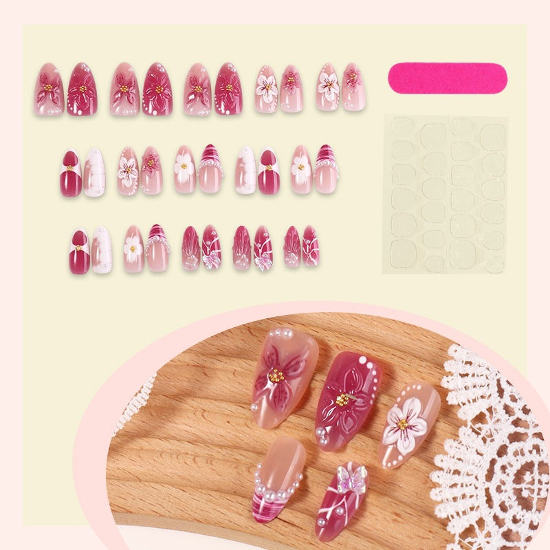 Artificial nail set with floral decorations and elegant patterns Stornfield