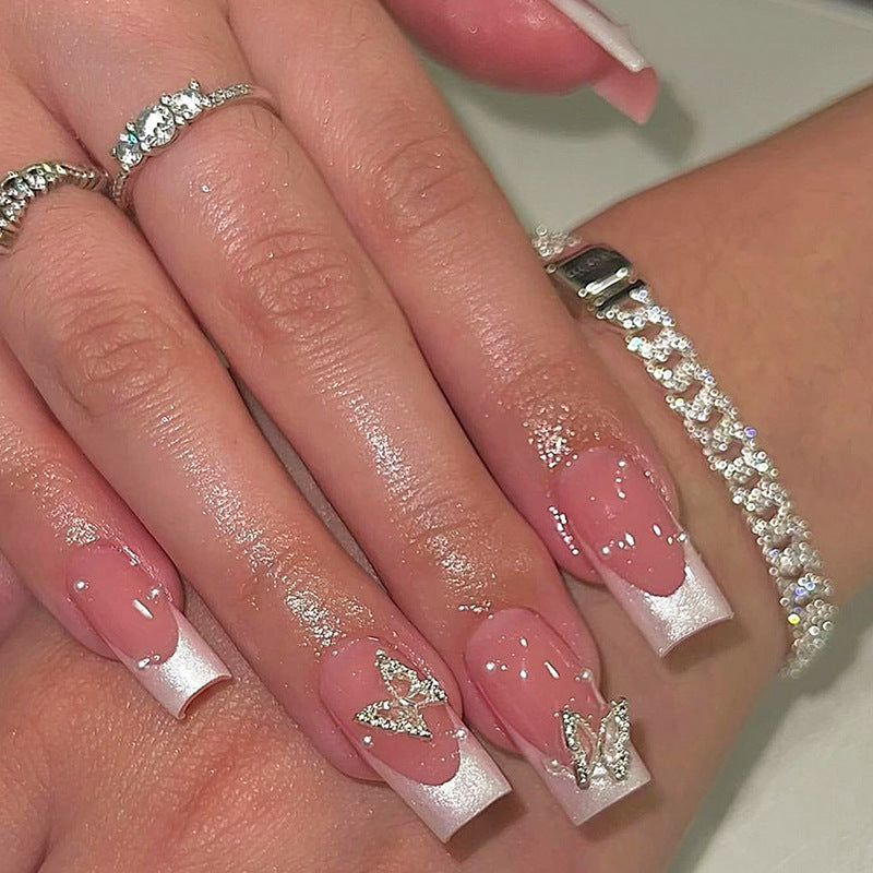 Nail art set with intricate designs and butterfly appliqués Stornfield