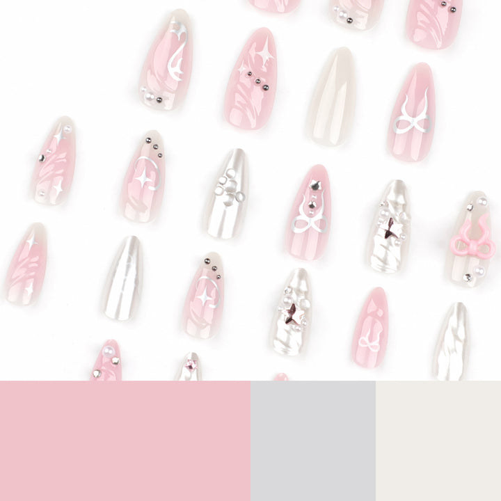 Artful stiletto nails in an elegant design with creative embellishments Stornfield
