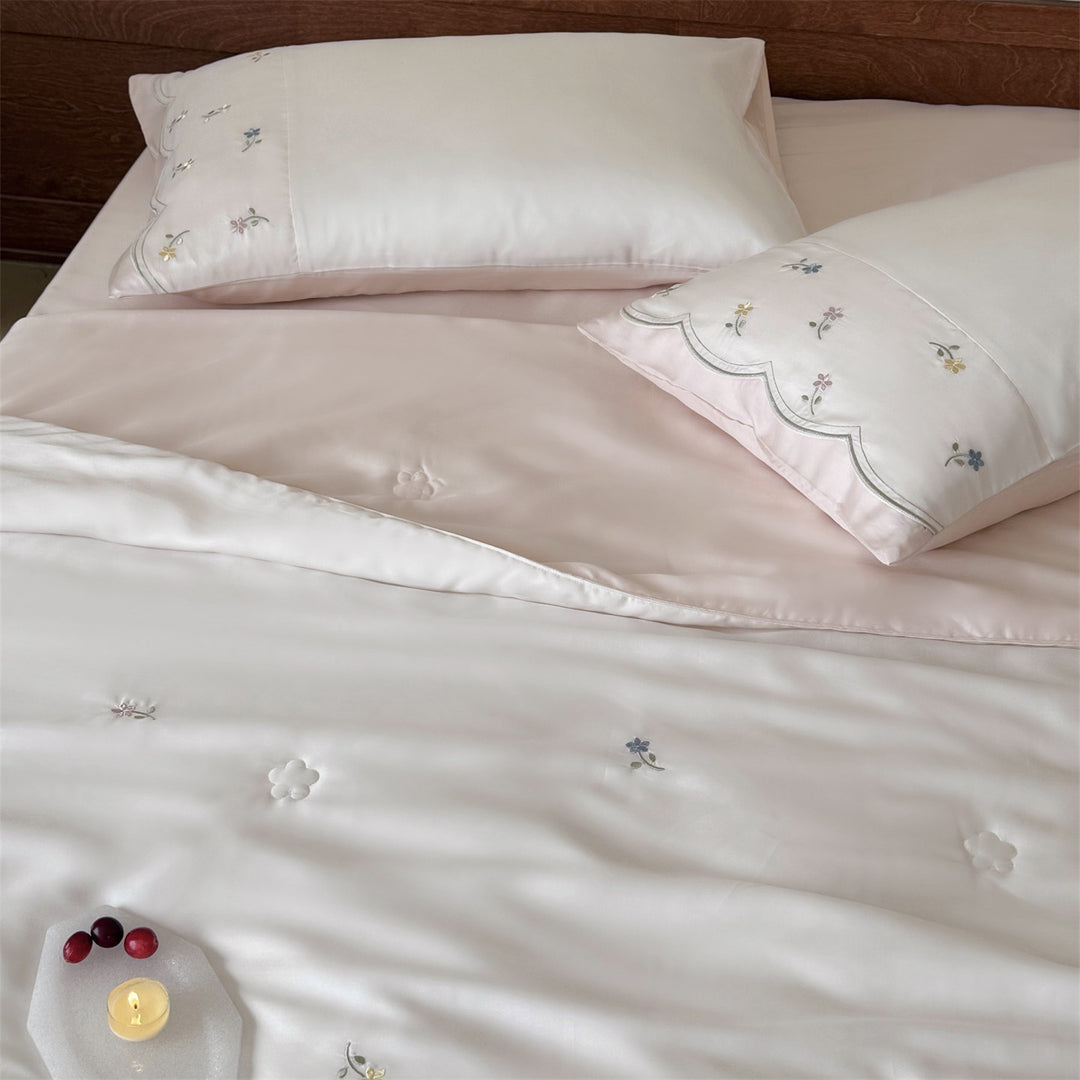 Embroidered satin bedding set with fine floral embroidery and silky-soft touch