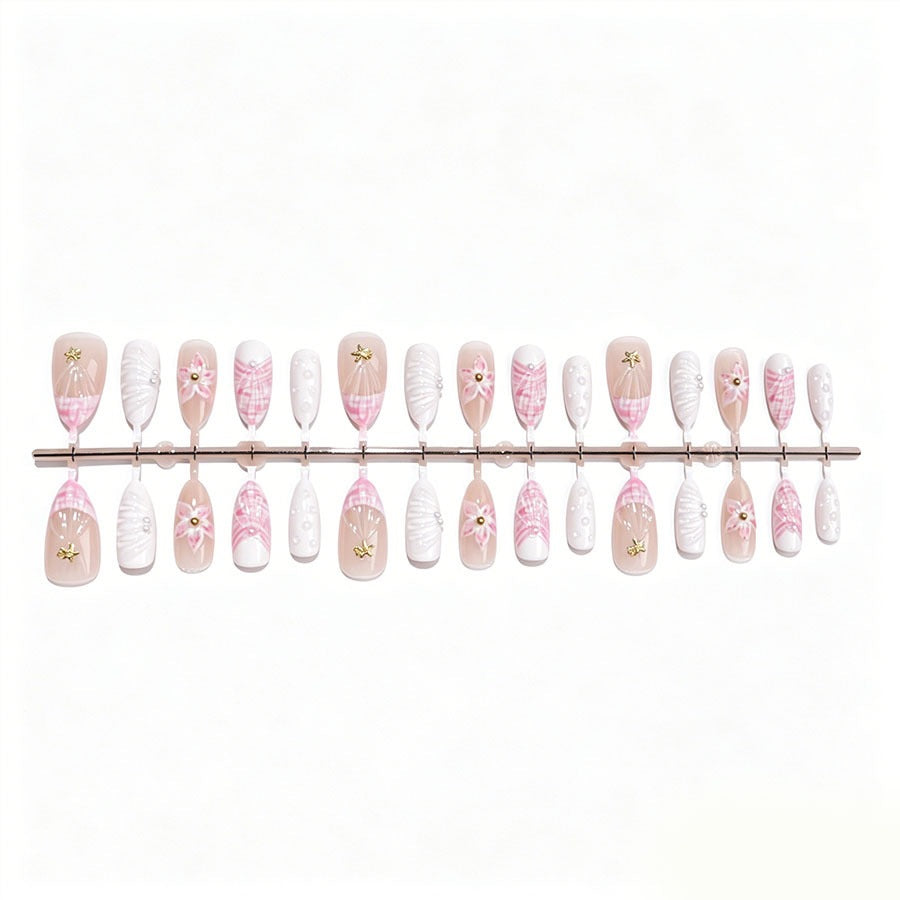 Art nail set with elegant floral decorations and glitter accents Stornfield