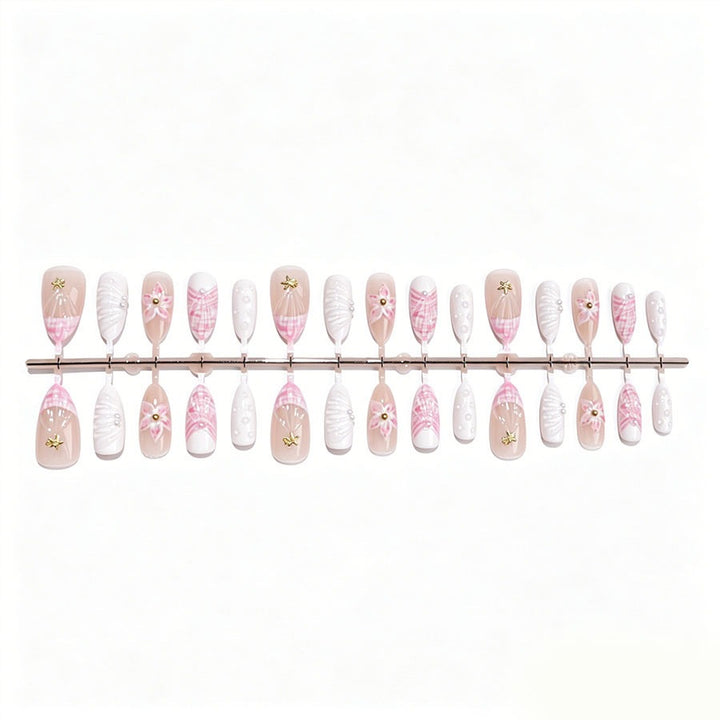 Art nail set with elegant floral decorations and glitter accents Stornfield