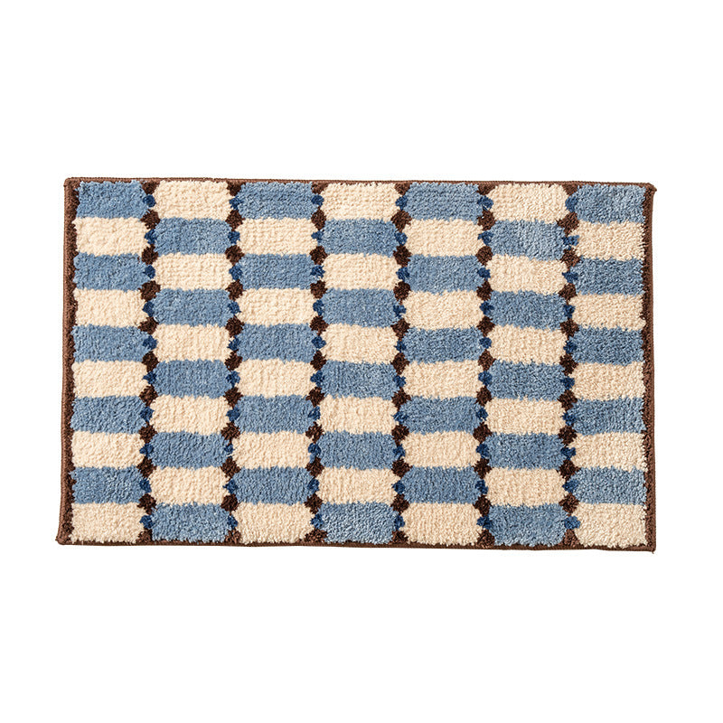 Hand-tufted bathroom mat with a velvety pile, non-slip latex backing, and geometric honeycomb check pattern Stornfield
