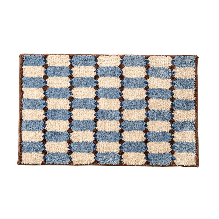 Hand-tufted bathroom mat with a velvety pile, non-slip latex backing, and geometric honeycomb check pattern Stornfield