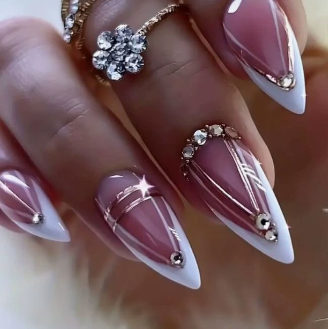 Acrylic nail set with elegant stiletto shape and luxurious embellishments Stornfield