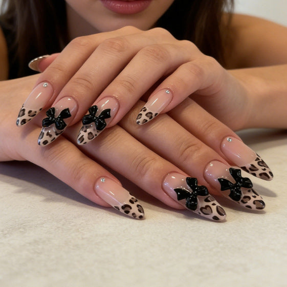 Artificial nail tips with elegant leopard pattern and bow decoration Stornfield