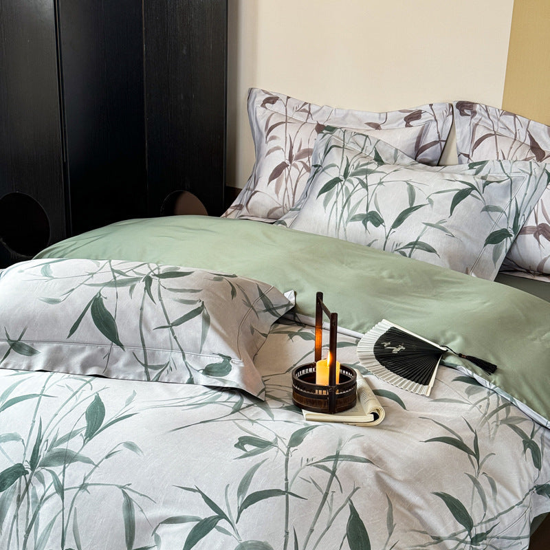 Bedding set made of cotton satin with botanical bamboo leaf print and reversible pillowcases