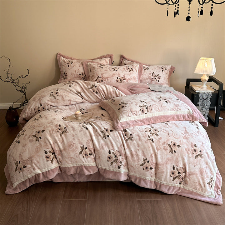 Luxurious quilted bedding set with velvet trim and floral branch motif