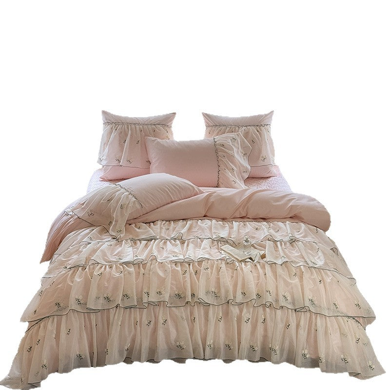 Vintage-inspired ruffle bed set with fine floral embroidery and ruched coverlet