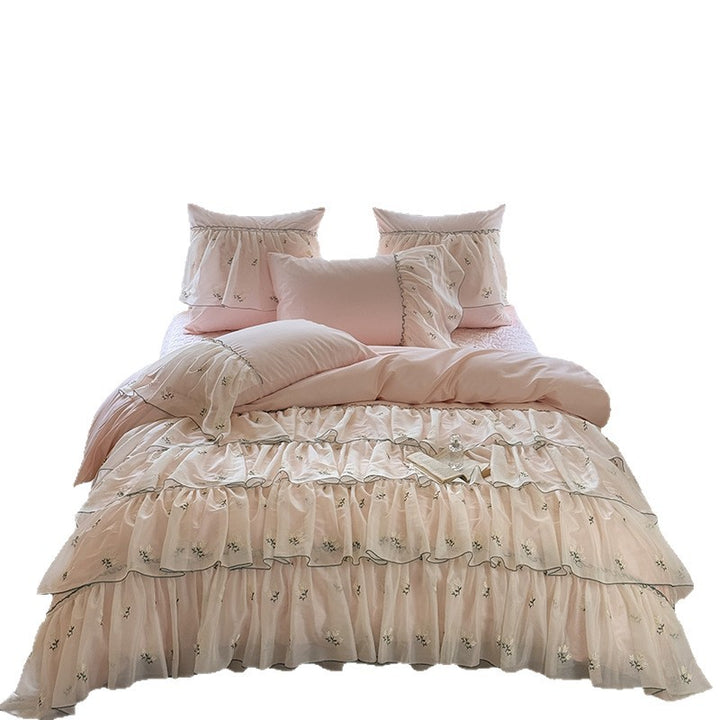 Vintage-inspired ruffle bed set with fine floral embroidery and ruched coverlet