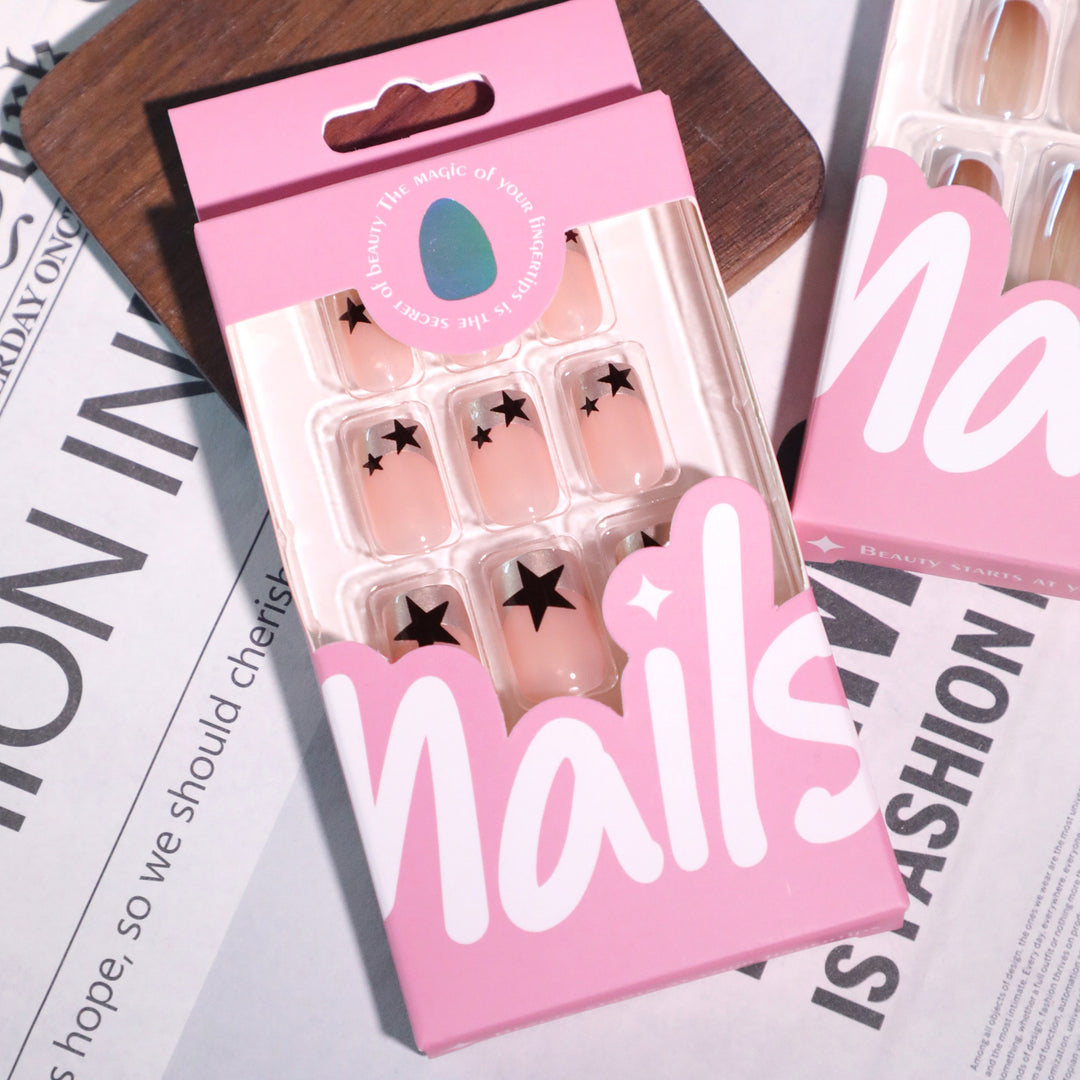 Sparkling nail art with stars and glitter accents Stornfield