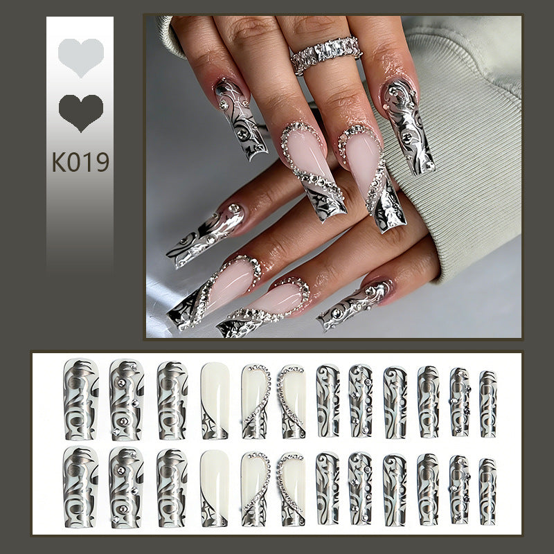 Elegant artificial nails with stylish embellishments Stornfield