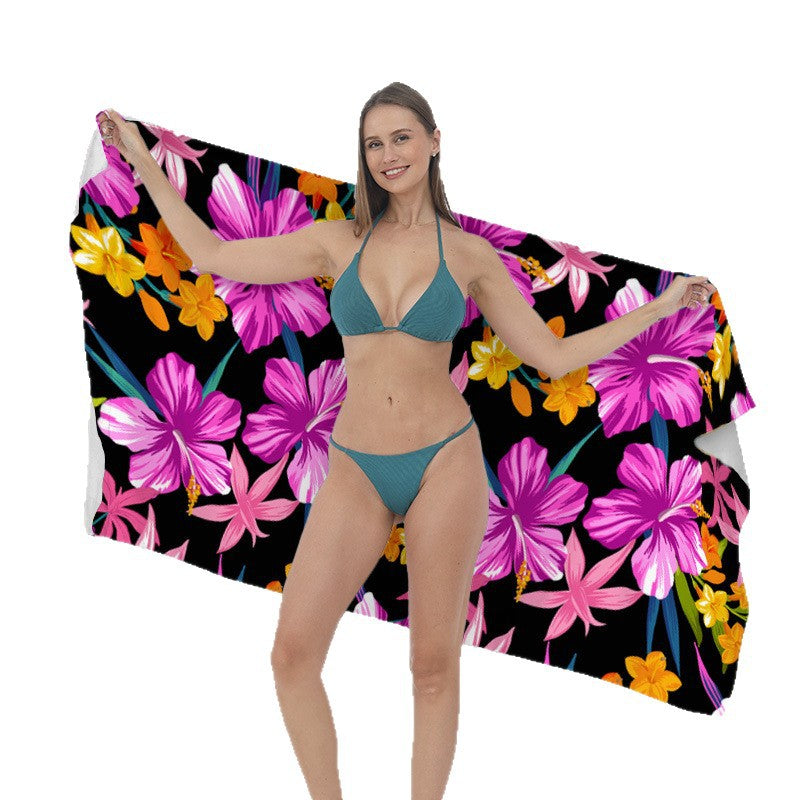 Beach towel with vibrant tropical plant motif Stornfield