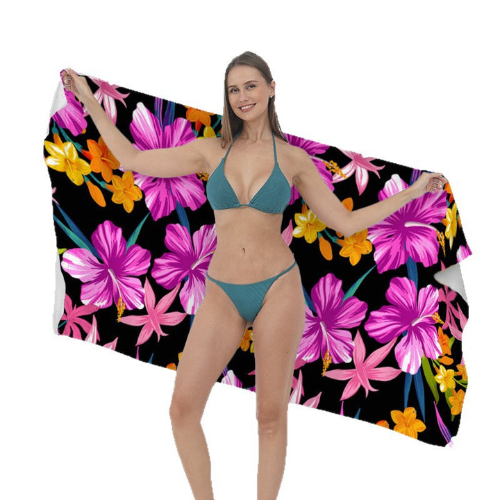 Beach towel with vibrant tropical plant motif Stornfield