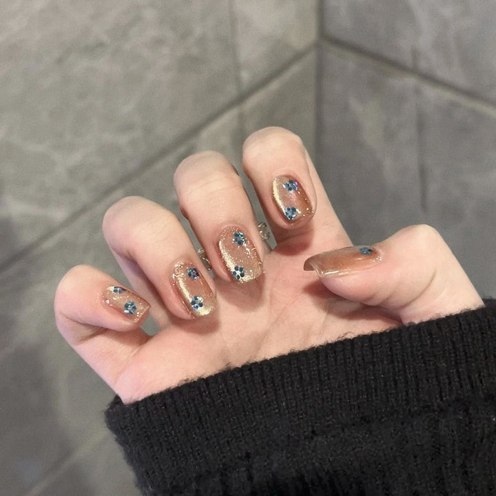 Glittering artificial nails with floral design Stornfield