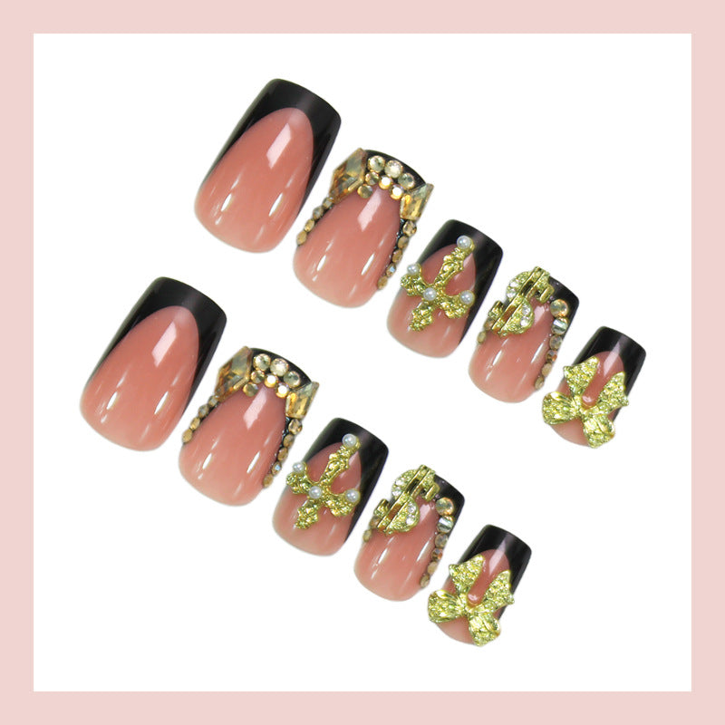 Artificial nails with elegant gold decorations and stylish black Stornfield