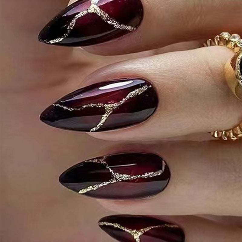 Elegant artificial nails with golden accents Stornfield