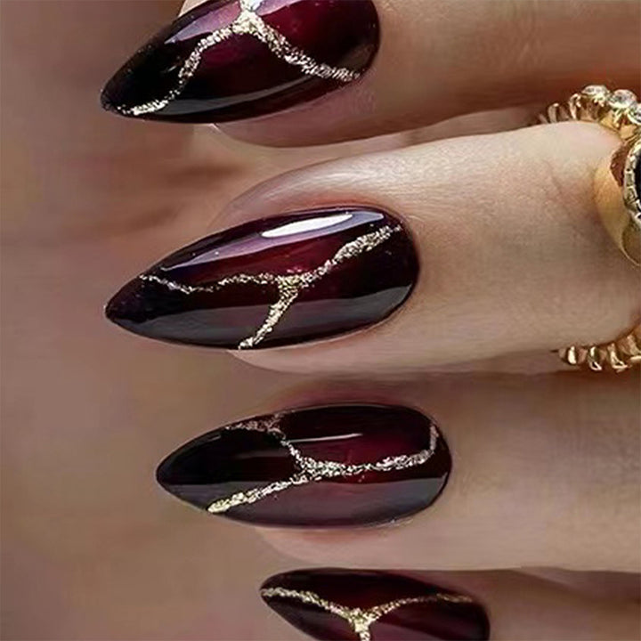 Elegant artificial nails with golden accents Stornfield