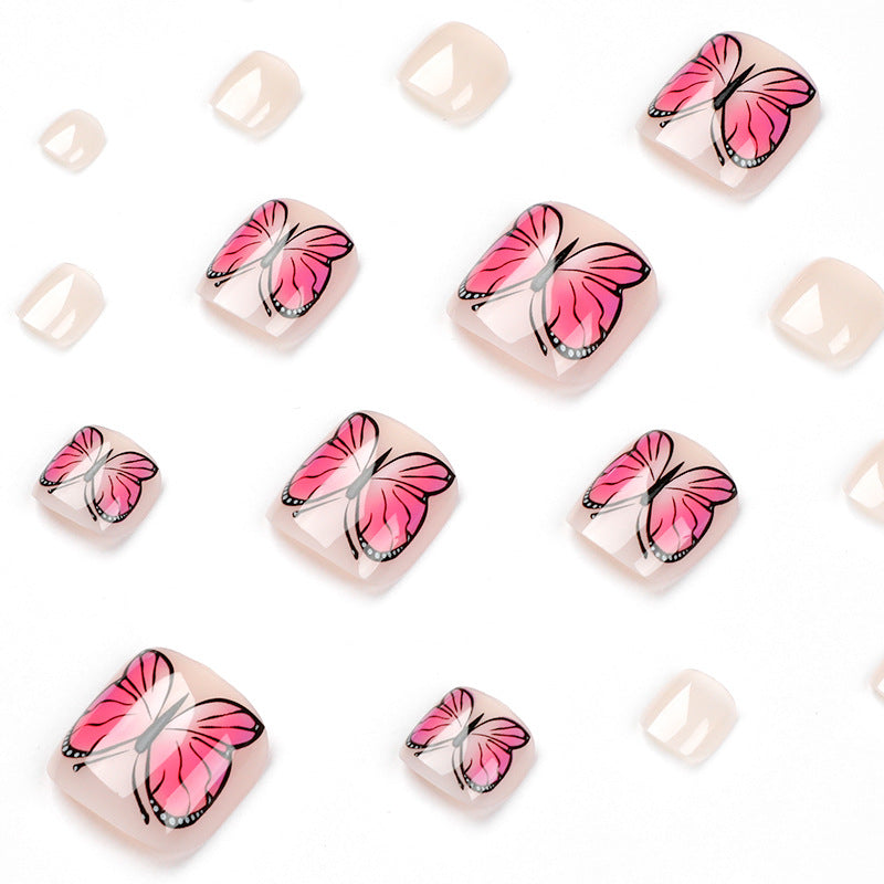 Artful toenail design with butterfly design Stornfield