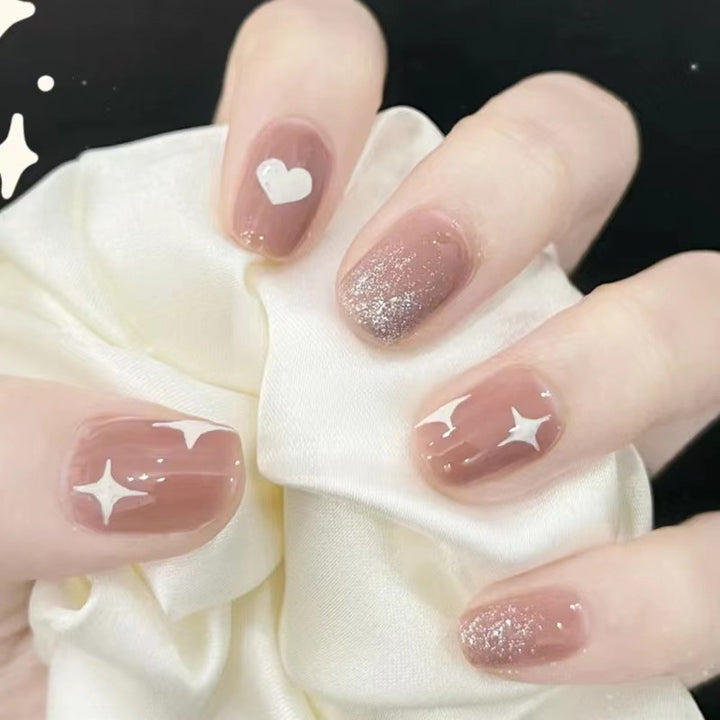 Artful nail art with heart and star design Stornfield