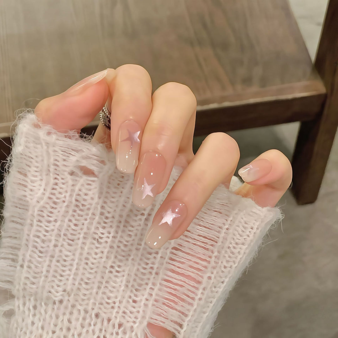 Artificial nails with sparkling stars and gentle gradient Stornfield
