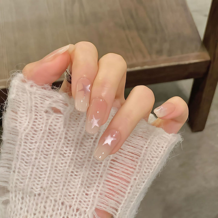 Artificial nails with sparkling stars and gentle gradient Stornfield