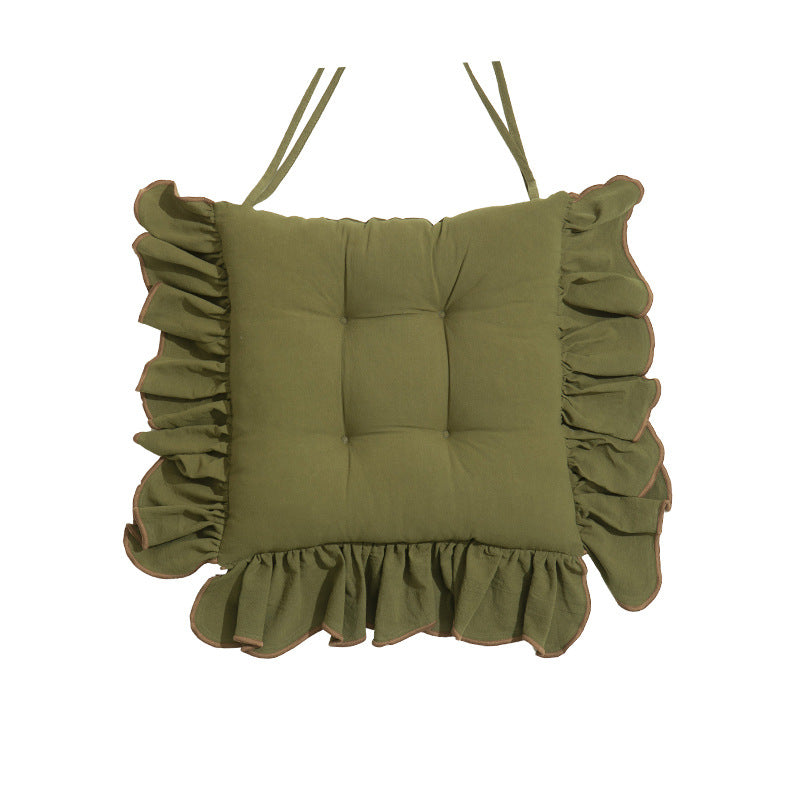 Padded chair cushion with ruffle and fastening bands