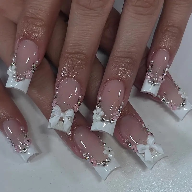 Artificial nails with elegant 3D bows and glitter accents Stornfield