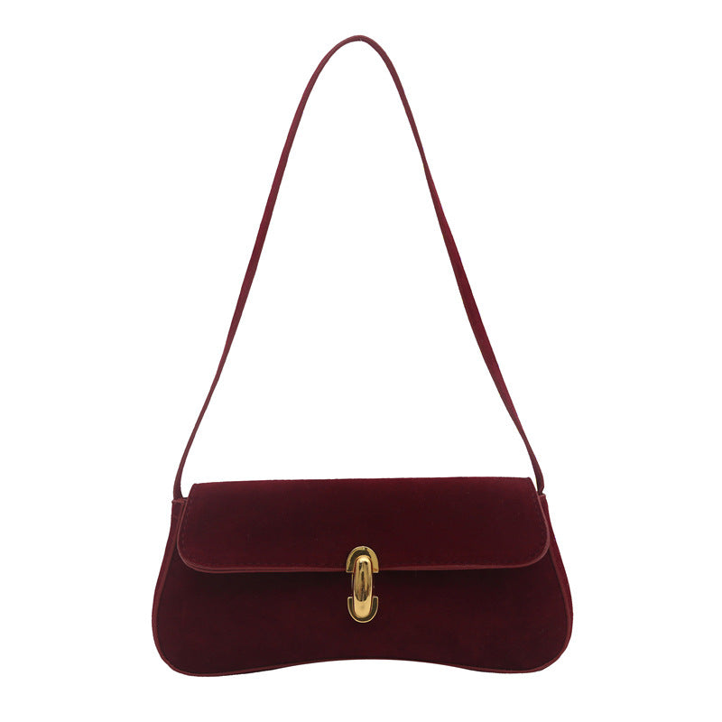 Elegant Suede Handbag with Playful Keychain