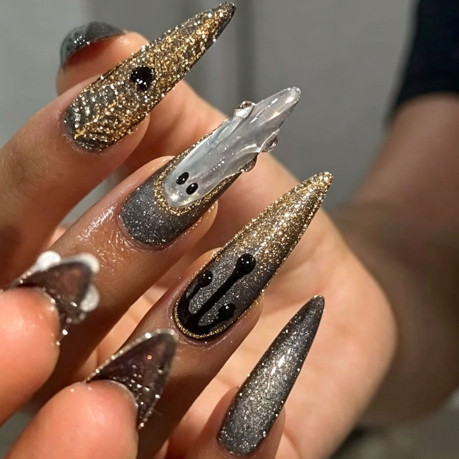 Artificial nail set with glamorous metallic elements and delicate details Stornfield