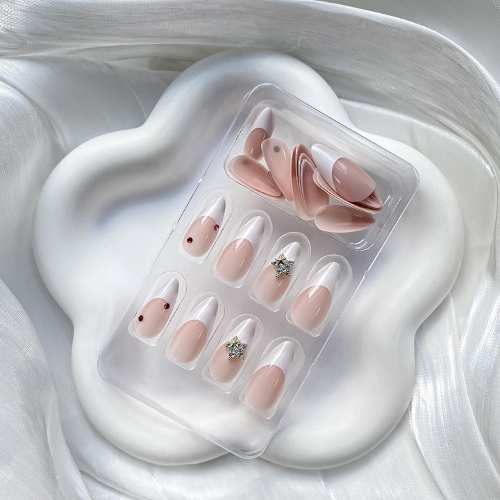 Artificial nail set with elegant French tips and sparkling accents Stornfield