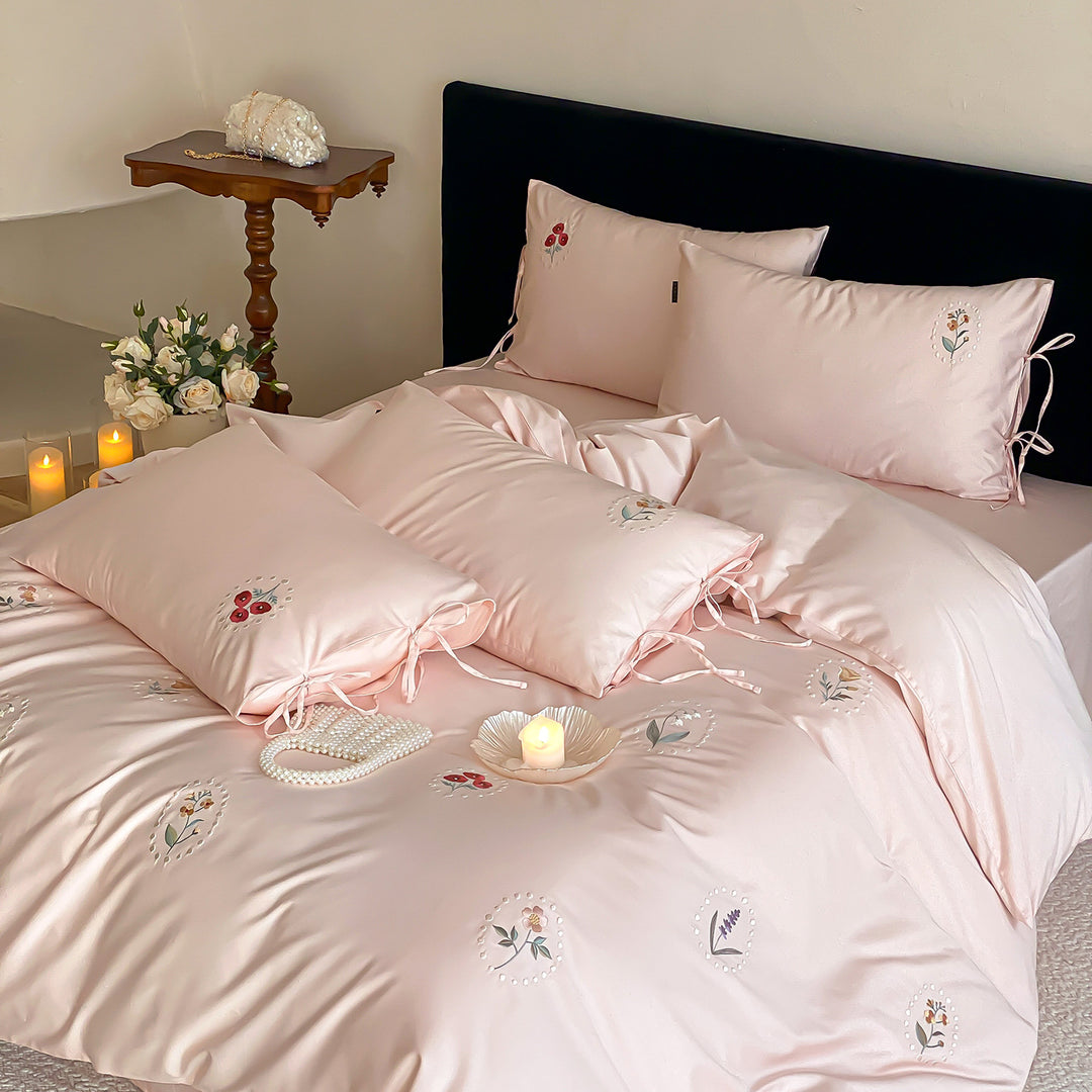 Luxurious cotton satin bedding set with delicate floral embroidery and ties
