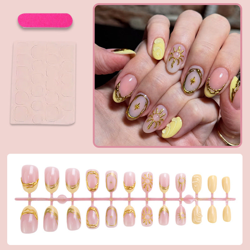 Acrylic nail set with elegant gold embellishments and creative designs Stornfield